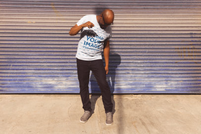 Mockup Featuring a Middle-Aged Man Wearing a T Shirt in Front of a Garage Door