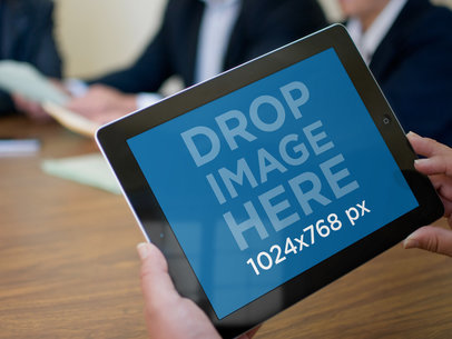 Mockup of an iPad Featuring People in a Business Meeting