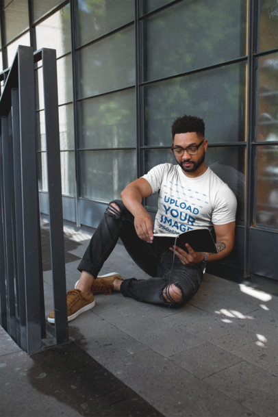 T-Shirt Mockup of a Cool Man with Beard Reading on the Floor
