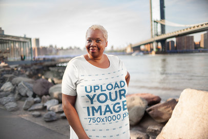 Mockup of a Woman Wearing a Plus Size T-Shirt in a City Setting