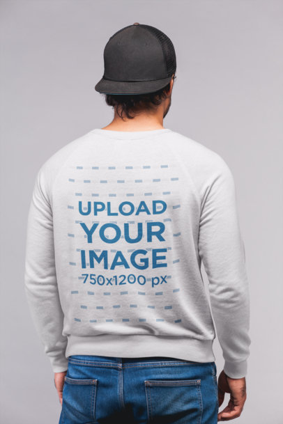Back View Sweatshirt Mockup Featuring a Man with a Black Cap and Jeans