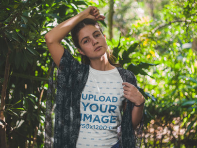 T-Shirt Mockup Featuring a Woman Around Plants