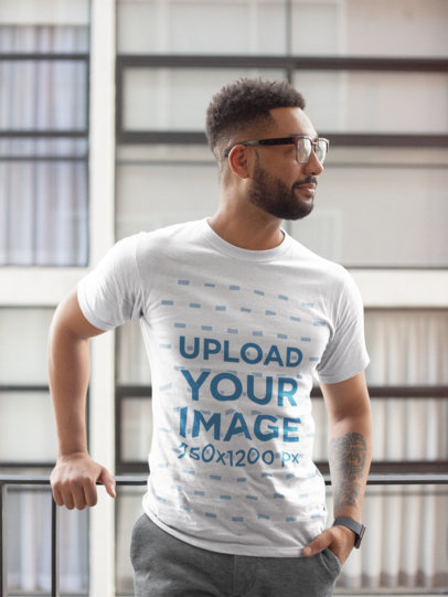 T-Shirt Mockup of a Man With a Hand in His Pocket and Looking to One Side 21342