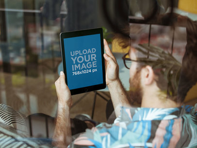 Mockup of an iPad Held by a Man with Glasses 22610