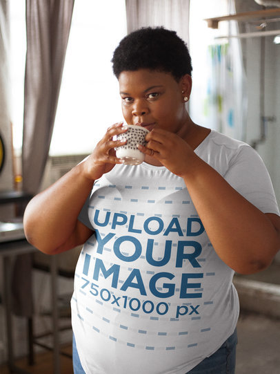 Mockup of a Woman Wearing a Plus Size T-Shirt Drinking from a Cup