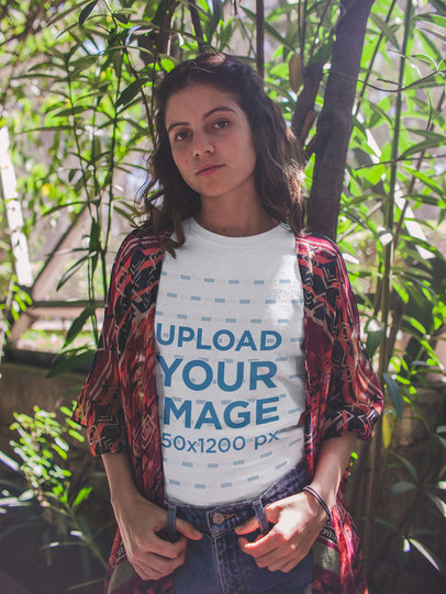 T-Shirt Mockup Featuring a Girl Leaning Against a Narrow Tree 18457