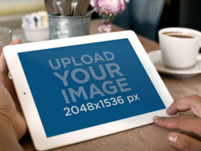Mockups of a White iPad on a Coffee Table