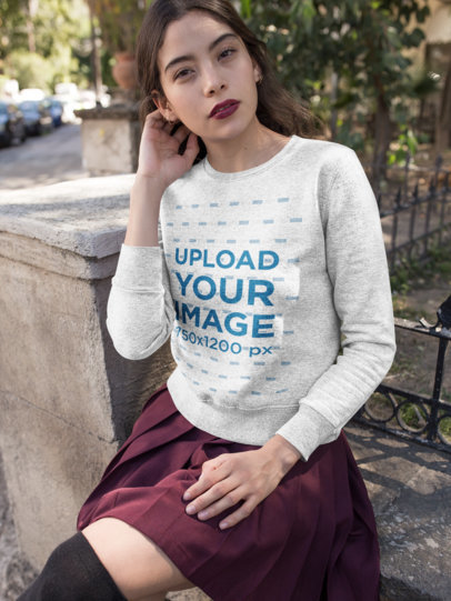 Mockup of a Woman Wearing a Heather Sweatshirt on the Street