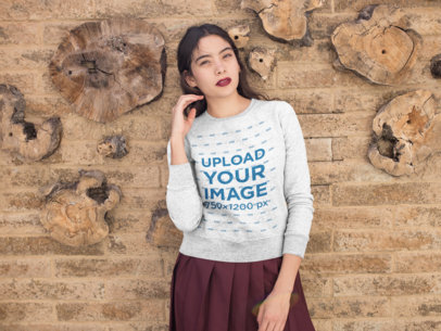 Sweatshirt Mockup of a Woman Standing in Front of a Textured Wall 18150