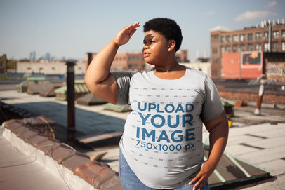 Plus Size Tee Mockup Featuring a Woman Shielding Her Eyes From The Sun