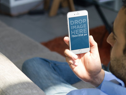 White iPhone Mockup of Man at Home