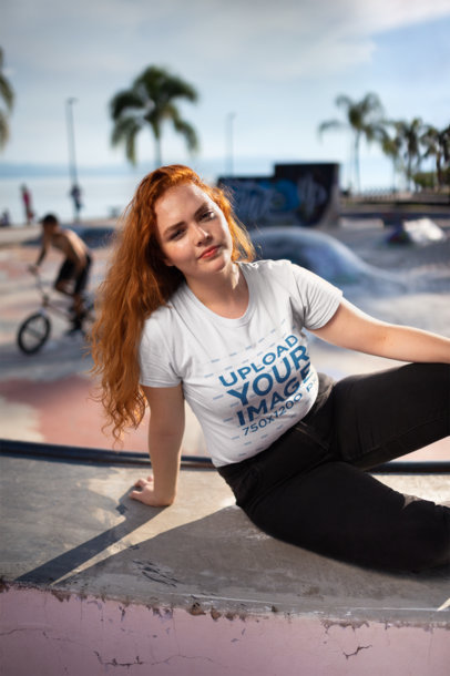 T-Shirt Mockup of a Woman at a Skateboard Park