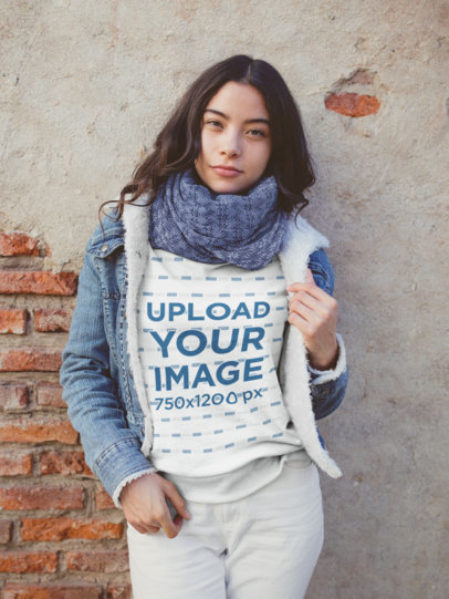 Mockup of a Woman Wearing a Sweatshirt Outside