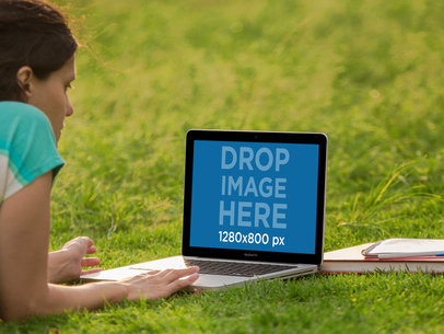 Laptop Mockup of a Woman Working on her Macbook at the Park