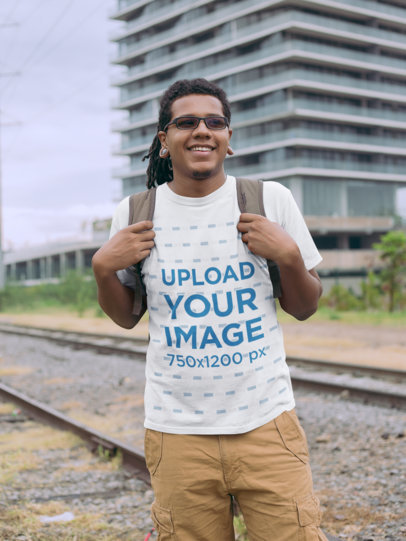 T-Shirt Mockup of a Man with Locs by a Railway