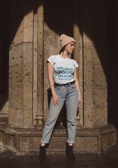 Round Neck Tee Mockup of a Woman Posing Outside a Stone Church