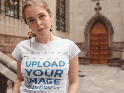 T-Shirt Mockup of a Woman with Freckles Outside a Church