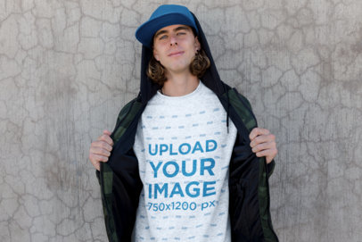 Crewneck Sweater Mockup Featuring a Skater Man Against a Concrete Wall