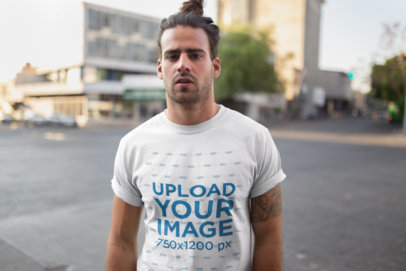 Round Neck Tee Mockup of a Man with a Tattoo on the Street