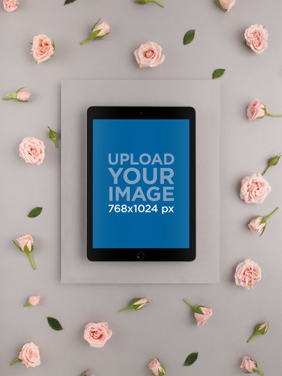 Space Gray iPad Mockup on a Gray Set Up with Pink Flowers 22547