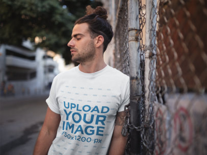 T-Shirt Mockup of a Man with a Man Bun Fade Hairstyle
