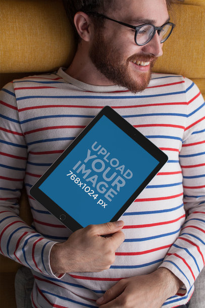 Mockup of a Man with Glasses Holding an iPad Against his Chest 22614