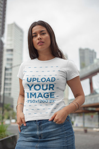 T-Shirt Mockup Featuring a Long-Haired Woman in the City