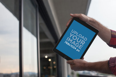 Mockup of an iPad Held on a Balcony 22618