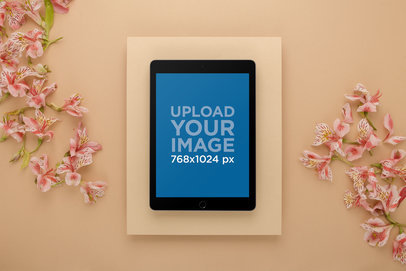 Mockup of an iPad on a Studio Set with Lilies