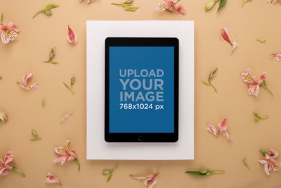 iPad Mockup on a White Floating Paper Over a Tan Surface with Lilies 22701