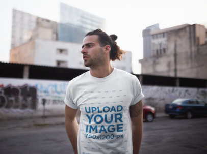 Tshirt Mockup Featuring a Long-Haired Man Downtown
