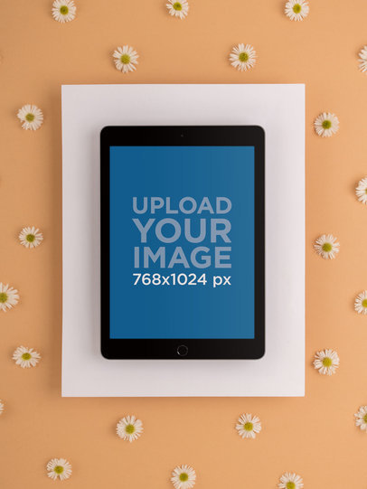 iPad Mockup Over Cardboard Surrounded by Daisies 22703