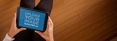 iPad Mockup Featuring a Woman Sitting on a Deck Floor a2630