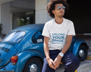 T-Shirt Mockup of a Man with an Afro Leaning on a Parking Rail 22258