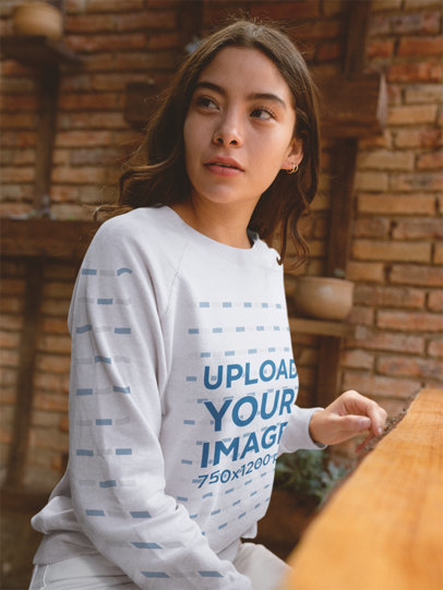 Crewneck Sweater Mockup of a Girl Waiting for a Friend at a Cafe 18135