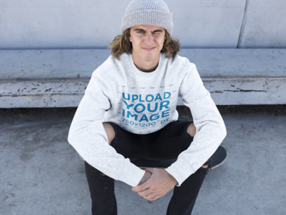 Mockup of a Skater Wearing a Crewneck Sweater Winking