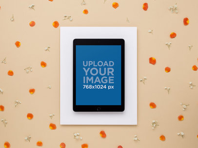 Mockup of an Ipad Lying Beside Scattered Flower Petals 22555