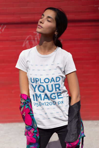 Mockup of a Woman Wearing a T-Shirt and Closing Her Eyes Against the Sun