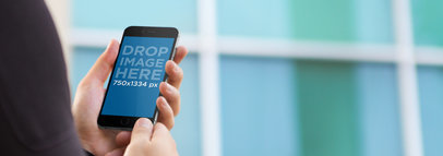 Mockup of a Businessman Using an iPhone 6 Outside the Office a2986