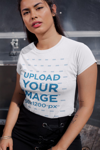 Mockup of a Woman with Tattoos Wearing a T-Shirt