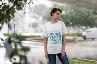 T-Shirt Mockup Showing a Girl Under a Bridge while Raining 22737