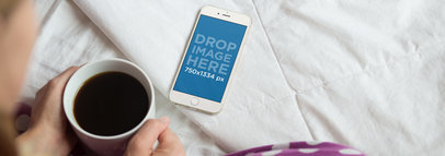 iPhone 6 Mockup of a Girl Sitting Cross-Legged in her Bed a3844