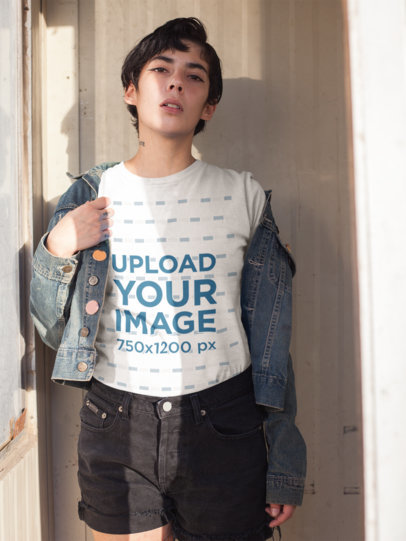T-Shirt Mockup Featuring a Woman With a Neck Tattoo Wearing Denim