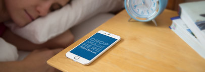iPhone 6 Mockup Featuring a Woman Sleeping 
