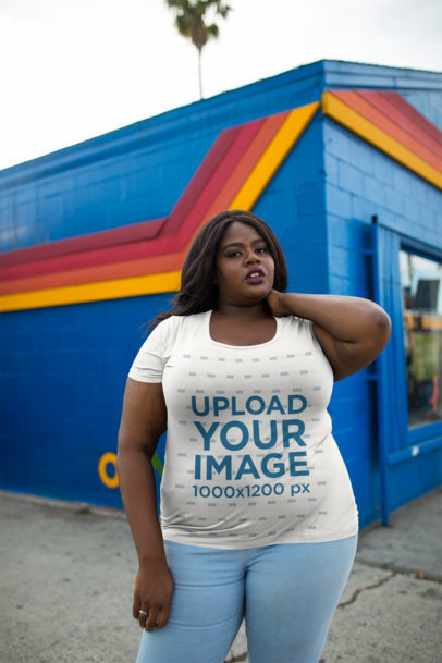 Plus Size Round Neck T-Shirt Mockup Featuring a Woman Outside a Blue and Orange Store