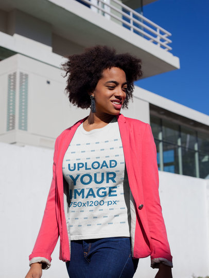 Mockup of a Woman Wearing a T-Shirt and a Sweet Pink Blazer Outside a House