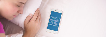iPhone 6 Mockup of a Woman Sleeping Next to her iPhone in Bed
