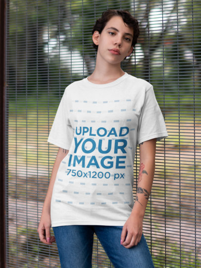 Round Neck Tee Mockup of a Woman Standing Against a Fence