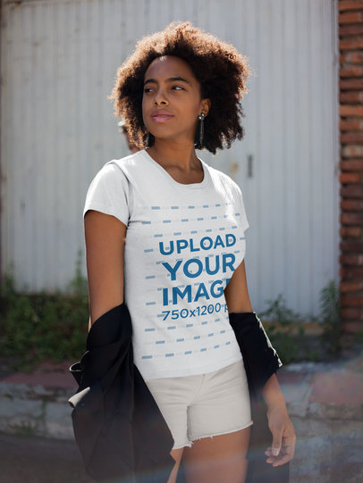 T-Shirt Mockup of a Woman with White Shorts Walking on the Street