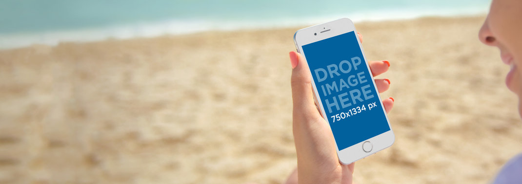 iPhone 6 Mockup of a Woman Holding an iPhone at the Beach